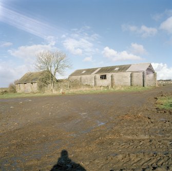 View of cottage and concrete shed from South East.