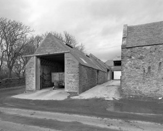 View of West range of steading and entrance to courtyard from South.