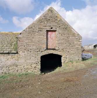 View of arched entrance at East end of stable from East.