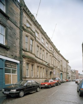 Oblique view from S of frontage, with 5-6 Maritime Street in foreground