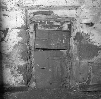 Interior.
Detail of steel doors of firebox at base of kiln.