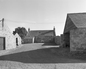 General view from NW showing SW elevation of mill on left, associated dwelling in centre, and farm buildings on right.