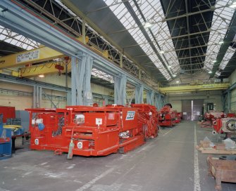 Motherwell, Craigneuk Street, Anderson Boyes
Fitting Shop (Dept. 51, built 1962): Interior view of east bay from south, showing Roof-bolting Machine (built for RJB Mining), with Road-header Machine in background (built for Ukraine)