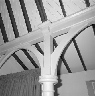 Interior.
Detail of column, brace and beam supporting roof structure.