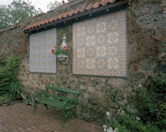 Portuguese tilework on wall adjacent to pond, detail