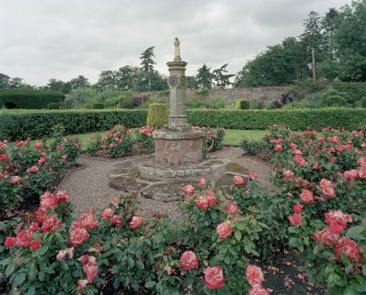 Walled garden, rose garden, sundial capped by small figure, view from SE