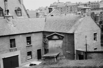 Geneal view of the Old Manse, Kirkstile, Hawick, showing a gravestone to Baillie John Hardie