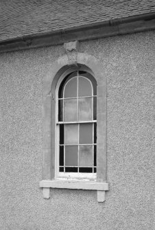 Detail of window with decorative keystone in SE elevation.