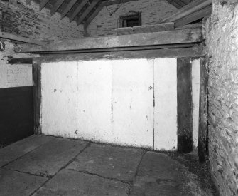Stable, (former steading), interior view of stall showing Caithness slabs.