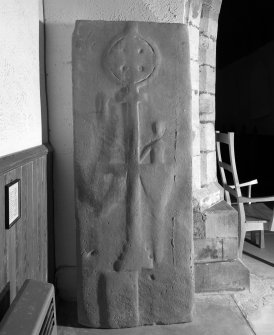 Interior, view of tomb slab beside pulpit in nave.
