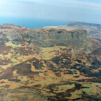 Oblique aerial view centred on the remains of the An Sgurr fort, taken from the SSW.