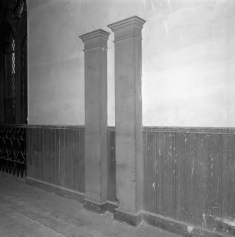 Detail of wooden pilasters on West wall of gallery
