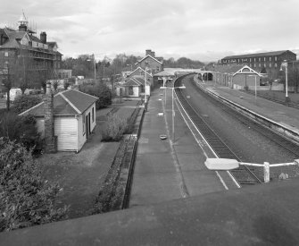 Dumfries, Railway Station
Elevated general view from E, showing wooden buildings at S end of Platform 1