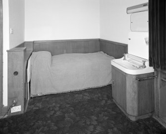 Presbytery, curate's room, bed and sink, detail