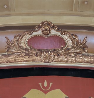 Auditorium, proscenium arch, gilded cartouche, detail