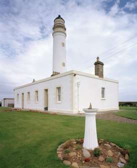 View from SW of lighthouse and keepers' house, with sundial in foreground, Barns Ness Lighthouse.