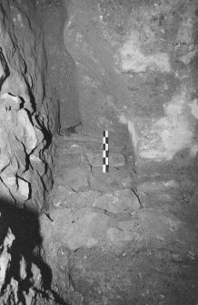 Excavation photograph : area A - E visible end of barbican wall, cut and sealed by offset footing 7.