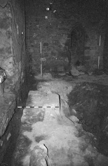 Excavation photograph : area A - looking along full length of barbican wall 4 to E wall of tower.