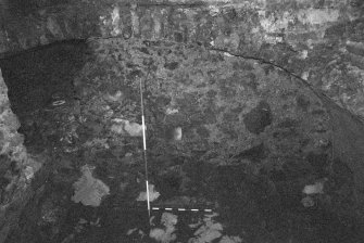 Excavation photograph : area B - slightly worn disturbed bedrock until recent shallow, gravelly flooring.