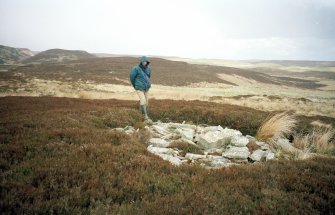 Groat's Loch, cairn from S with Garrywhin Fort (ND34SW 3)  in background.  With Mr P McKeague