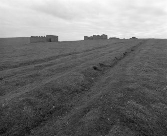 View of brick buildings and access road from ENE.