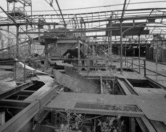 Newtongrange, Lady Victoria Colliery, Pithead Building (Tub Circuit, Tippler Section, Picking Tables)
Pithead area:  view from west of central bays at upper decking level.  This area contained ploughs and conveyors which transferred coal to the picking tables.  The headframe above the shaft can be seen through the exposed steel roof trusses