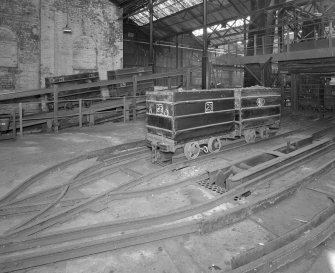 Newtongrange, Lady Victoria Colliery, Pithead Building (Tub Circuit, Tippler Section, Picking Tables)
Pithead upper decking level, Tub Circuit: view from north east showing east end of tub circuit, with cage and shaft just visible (right), and elevating creeper (distant left)
