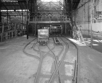 Newtongrange, Lady Victoria Colliery, Pithead Building (Tub Circuit, Tippler Section, Picking Tables)
Pithead upper decking level, Tub Circuit: view from east of east end of tub circuit, showing elevating creeper (left), and shaft (centre)