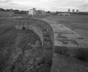 Kirkcaldy Harbour
Elevated view from south east along top of sea wall forming the south end of East Pier, showing curved section of wall at north-east end of Outer Harbour