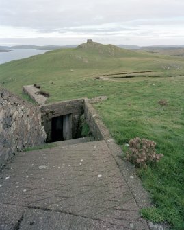 View of W gun emplacement magazine and observation post from W (possible WWII peat cutting area in between).