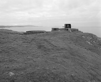 View of W gun emplacement from E, with ready-use ammunition lockers and magazine.