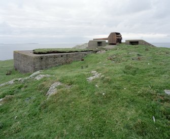 View of W gun emplacement from SE, with ready-use ammunition lockers and magazine.