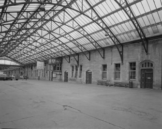 Perth, Leonard Street, General Station
Platforms 8 & 9 (left): oblique view from south west beneath steel-framed glazed canopy showing west facade of main station offices, including ornate clock