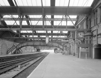 Perth, Leonard Street, General Station
Platforms 3 (left) and 4 (centre): general view from north west under main canopy, showing footbridge linking to the two platforms, and a second ornate clock