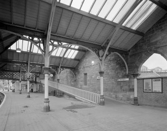 Perth, Leonard Street, General Station
Platform 2: view from north east showing details of steel-framed glazed canopy (supported on ornate cast-iron columns), and ramp (with gothic-style cast-iron ballustrade) leading to footbridge