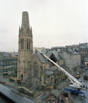 High level general view from SE showing front elevation supported by scaffolding