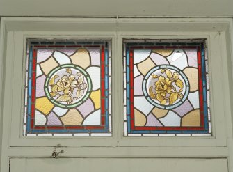 Interior.
Detail of stained glass fanlight above entrance.