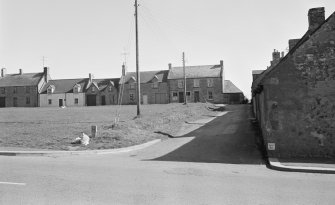 General view of south and west sides of the Green, Swinton village