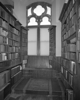 Detail of library shelving and window seat