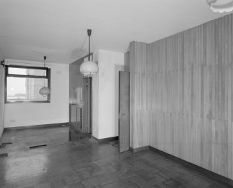 Top floor, caretaker's flat, view of living room cum kitchen