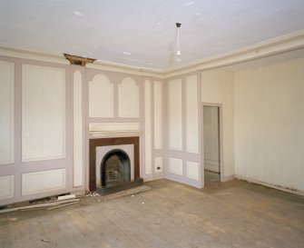 Interior.View of ground floor /North room dining room from South showing sideboard recess, fireplace and panelling