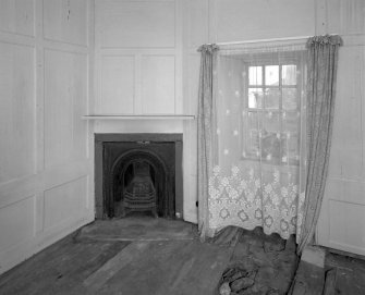 Interior. View of ground floor North East room from West showing panelling and fireplace