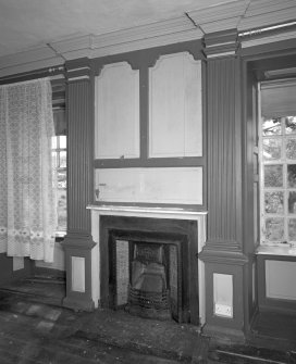 Interior. View of first floor South room/ drawing room from North showing fireplace flanked by giant fluted pilastersand Nineteenth Century grate
