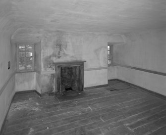 Interior. View of second floor North room from South showing coombed ceiling and fireplace
