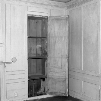 Interior. View of first floor North room/principal bedroom showing detail of cupboard behind the panelling