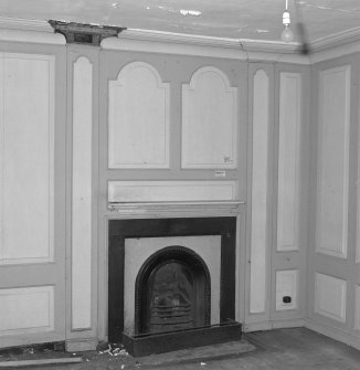 Interior.View of ground floor /North room dining room from South showing fireplace and panelling