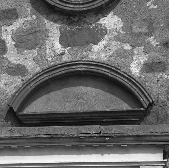 Detail of semicircular pediment above entrance