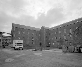 Selkirk, Dunsdale Haugh, Dunsdale Road, Riverside Mills
View from north north west of north east side of original spinning mill, showing its 'T'-shaped plan, its north-east leg being visible to the left, and north-west leg to the right . At the time of the survey, the mill was used predominantly as a warehouse.