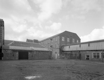 Selkirk, Dunsdale Haugh, Dunsdale Road, Riverside Mills
View from east of overhead gantry carrying passageway from Original Mill to New Mill (centre), with Teasing Department (situated to north west side of former engine house) visible to left