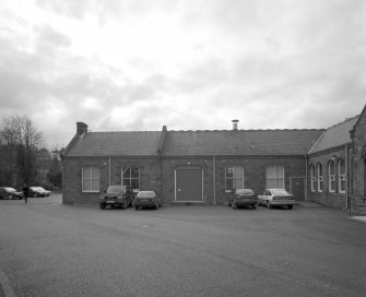 View from NE of NE facade of mill adjacent to main offices and entrance (E end of NE side)